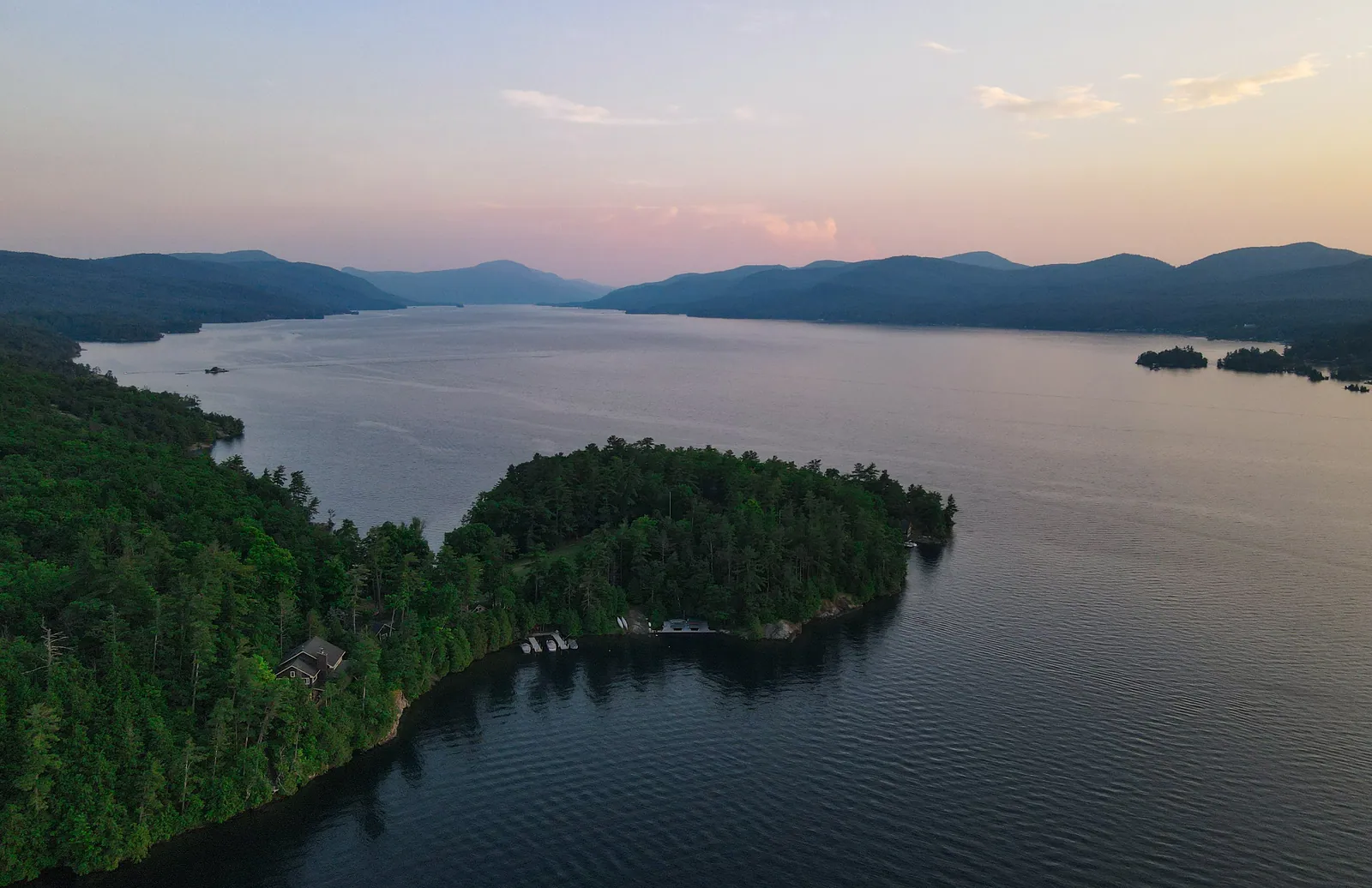 Sleepaway camp Adirondack Camp after sunset on beautiful and serene Lake George, NY